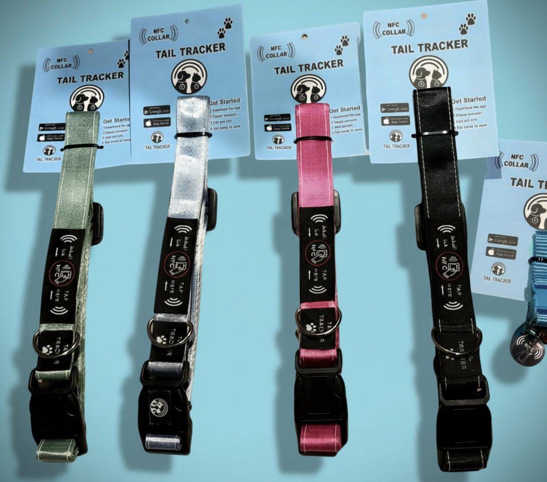 Four dog collars with tracking devices on a white background